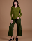 Alex is wearing Gingham Long Sleeve Baby Tee in Summer Olive and evergreen Drop Pocket Cargo Pants