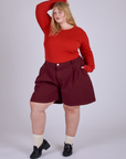 Pleated Trouser Shorts in Red Wine and mustang red Long Sleeve Gingham Baby Tee on Juliet