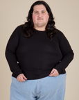 Sam is 5’10” and wearing XL Long Sleeve Baby Tee in Basic Black