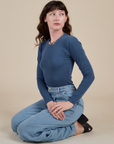 Alex is wearing Long Sleeve Baby Tee in French Blue