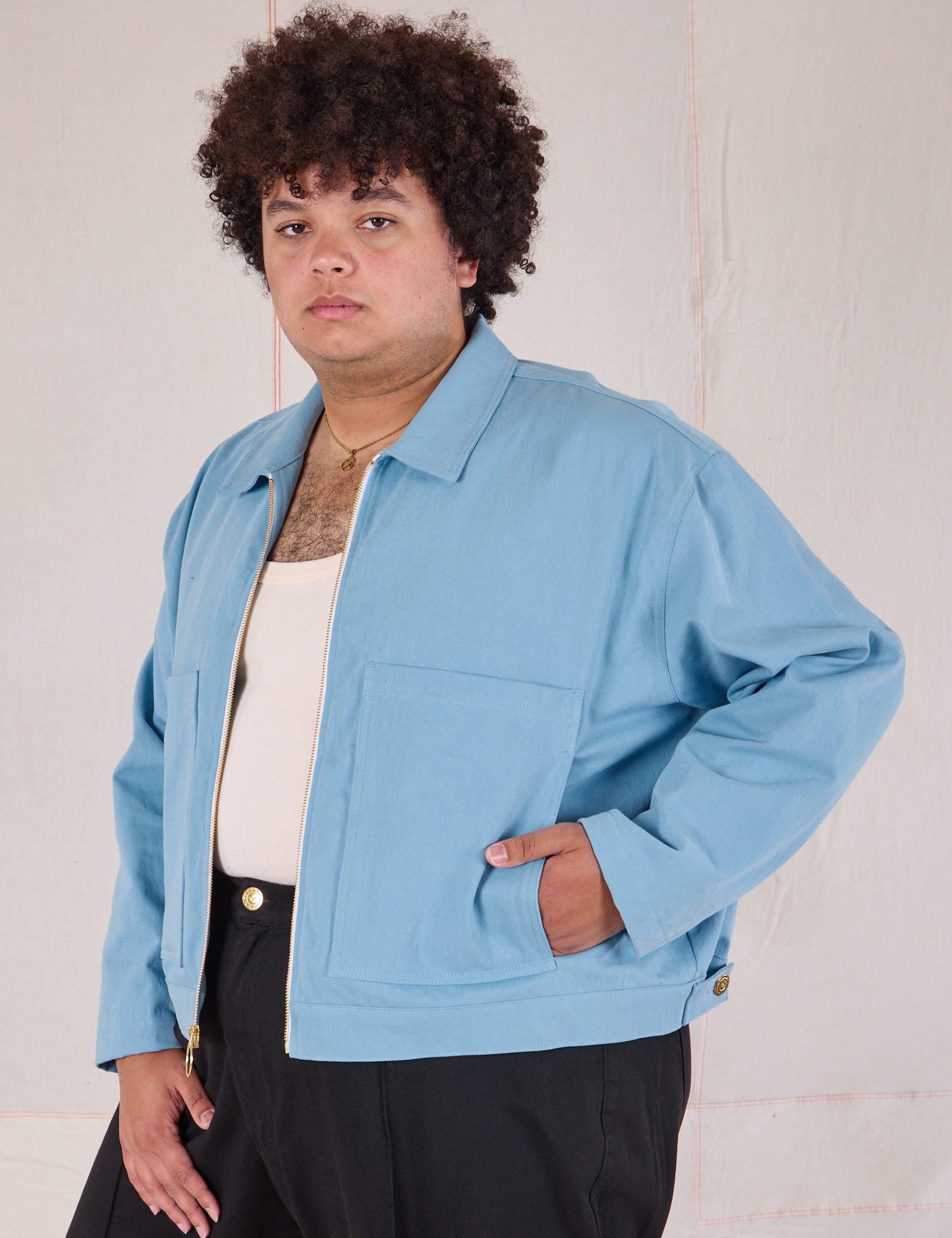 Mechanic Jacket in Baby Blue angled front view on Miguel
