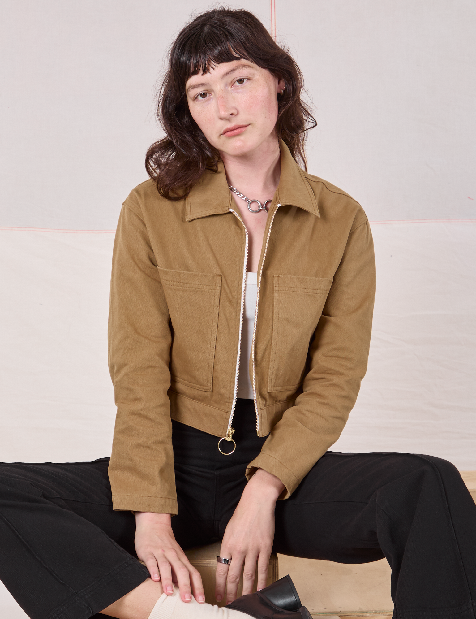 Alex is wearing Mechanic Jacket in Desert Brown