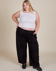 Juliet is wearing Muscle Tee in Vintage Tee White and black Drop Pocket Cargo Pants