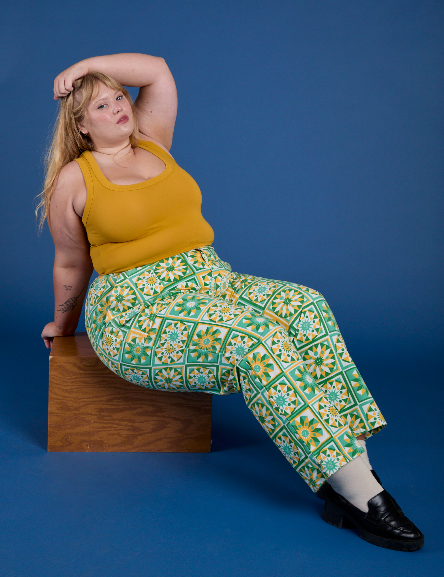 Juliet is wearing Work Pants in Spring Quilt Print and mustard yellow Cropped Tank