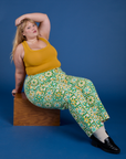 Juliet is wearing Work Pants in Spring Quilt Print and mustard yellow Cropped Tank