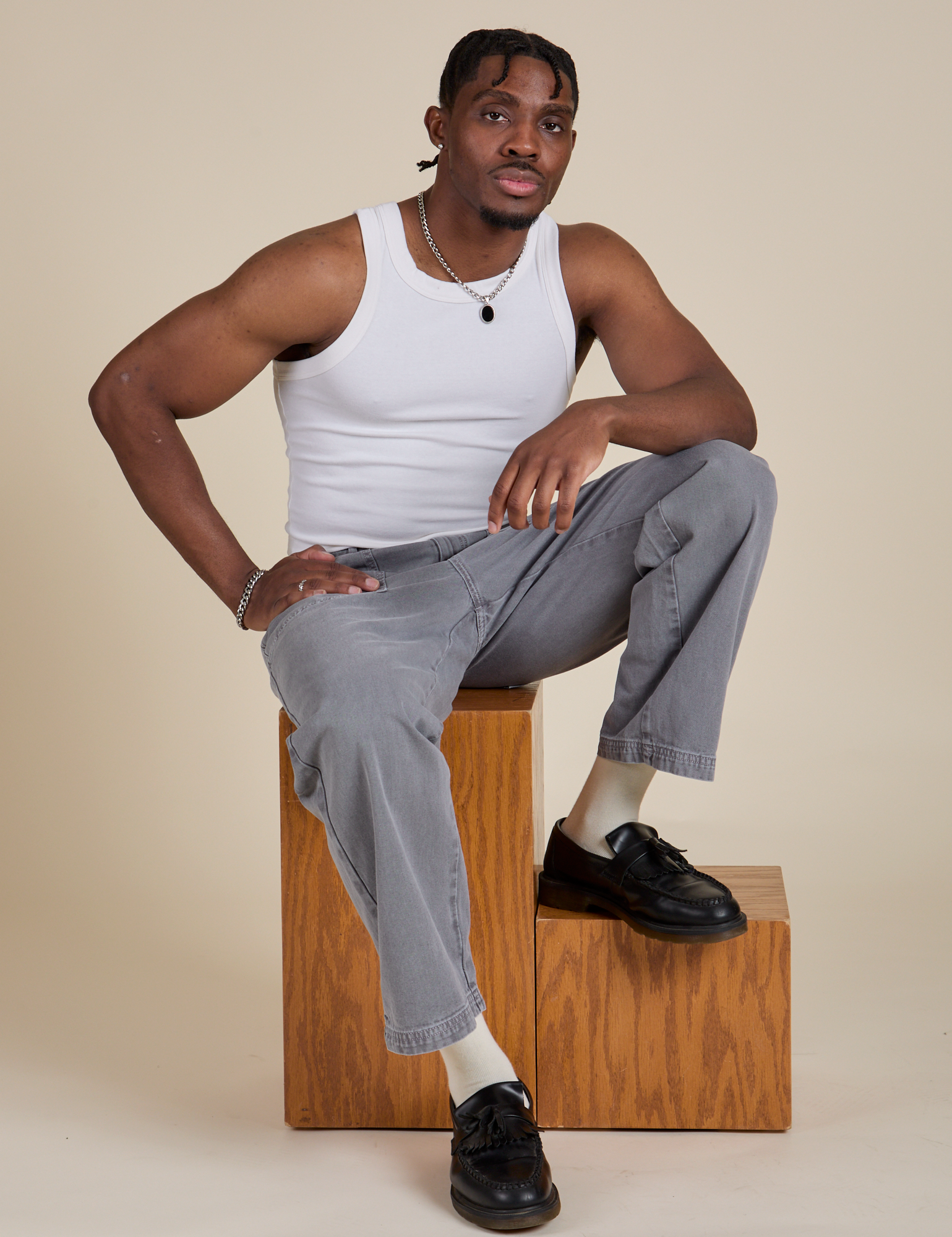 Racerback Tank in Vintage Tee White and washed grey Work Pants on Isaac