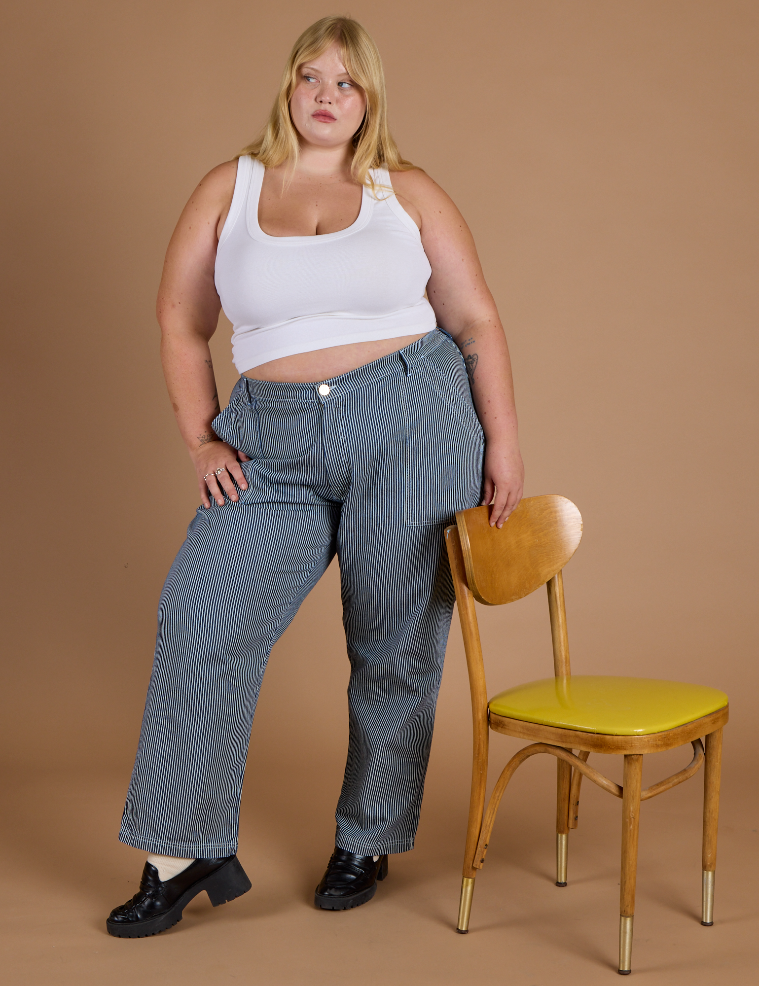 Juliet is wearing Railroad Denim Work Pants in Natural and Cropped Tank in Vintage Tee White