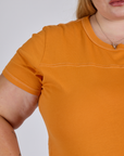 Jr. Varsity Tee in Creamsicle Orange front close up on Juliet