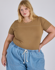 Juliet is 5’7” and wearing L Jr. Varsity Tee in Desert Brown