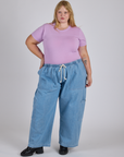 Juliet is wearing Jr. Varsity Tee in Lilac Purple and light wash Denim Drop Pocket Pants