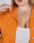 Pantry Button-Up in Creamsicle Orange close up on Juliet
