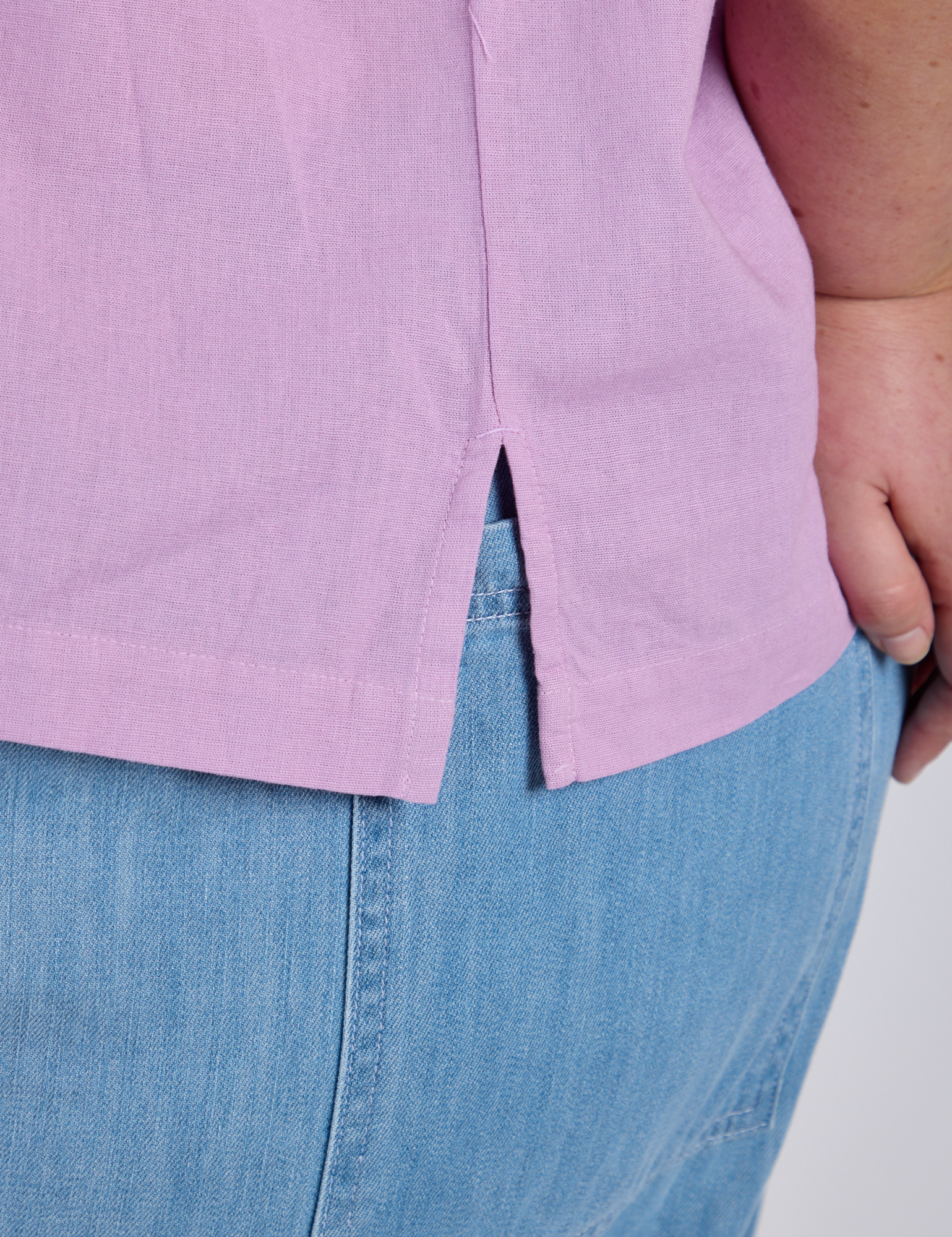 Close up of Pantry Button-Up in Lilac Purple side vent on Juliet