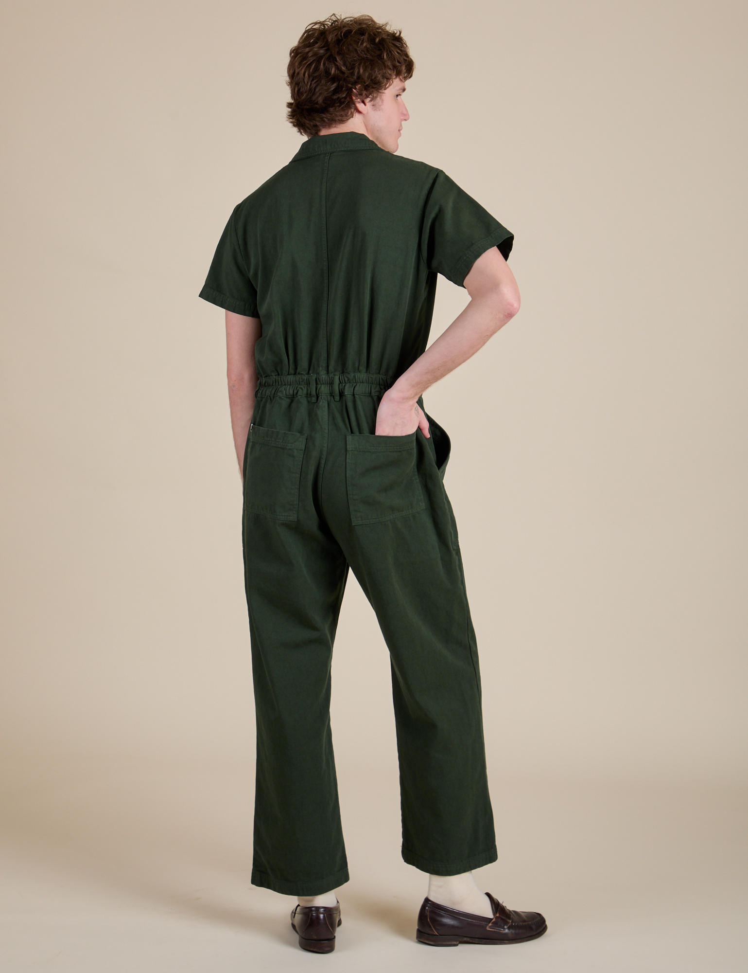 Back view of Short Sleeve Jumpsuit in Swamp Green on Quinn