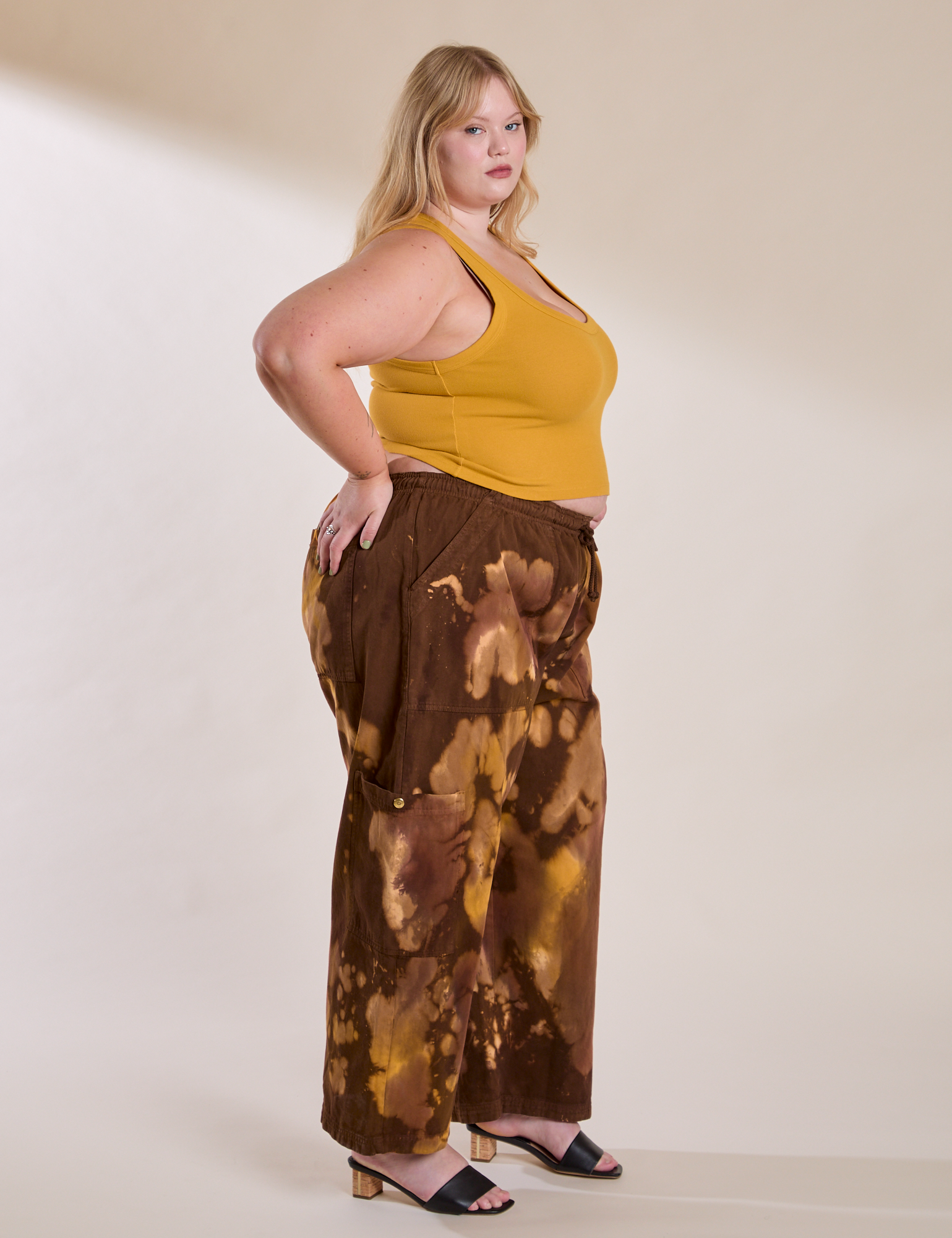 Side view of Magic Waters Drop Pocket Pants in Honey Brown and mustard yellow Cropped Tank on Juliet