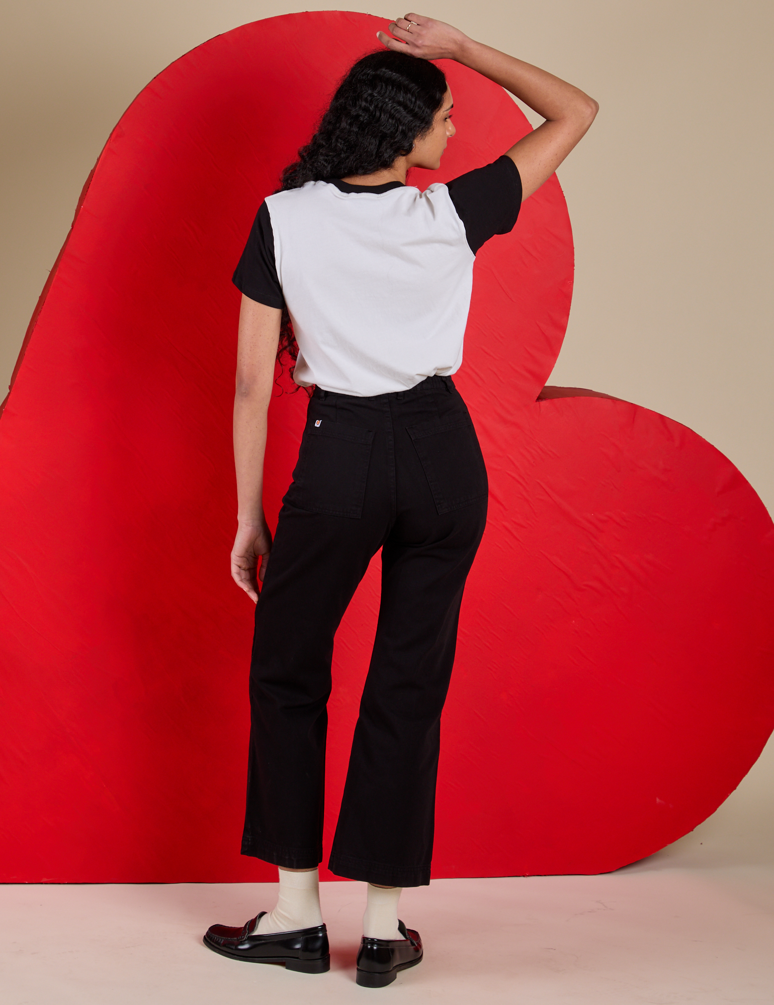 Back view of Vintage Tee in Don't Call Me and black Western Pants on Shahana