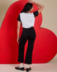 Back view of Vintage Tee in Don't Call Me and black Western Pants on Shahana