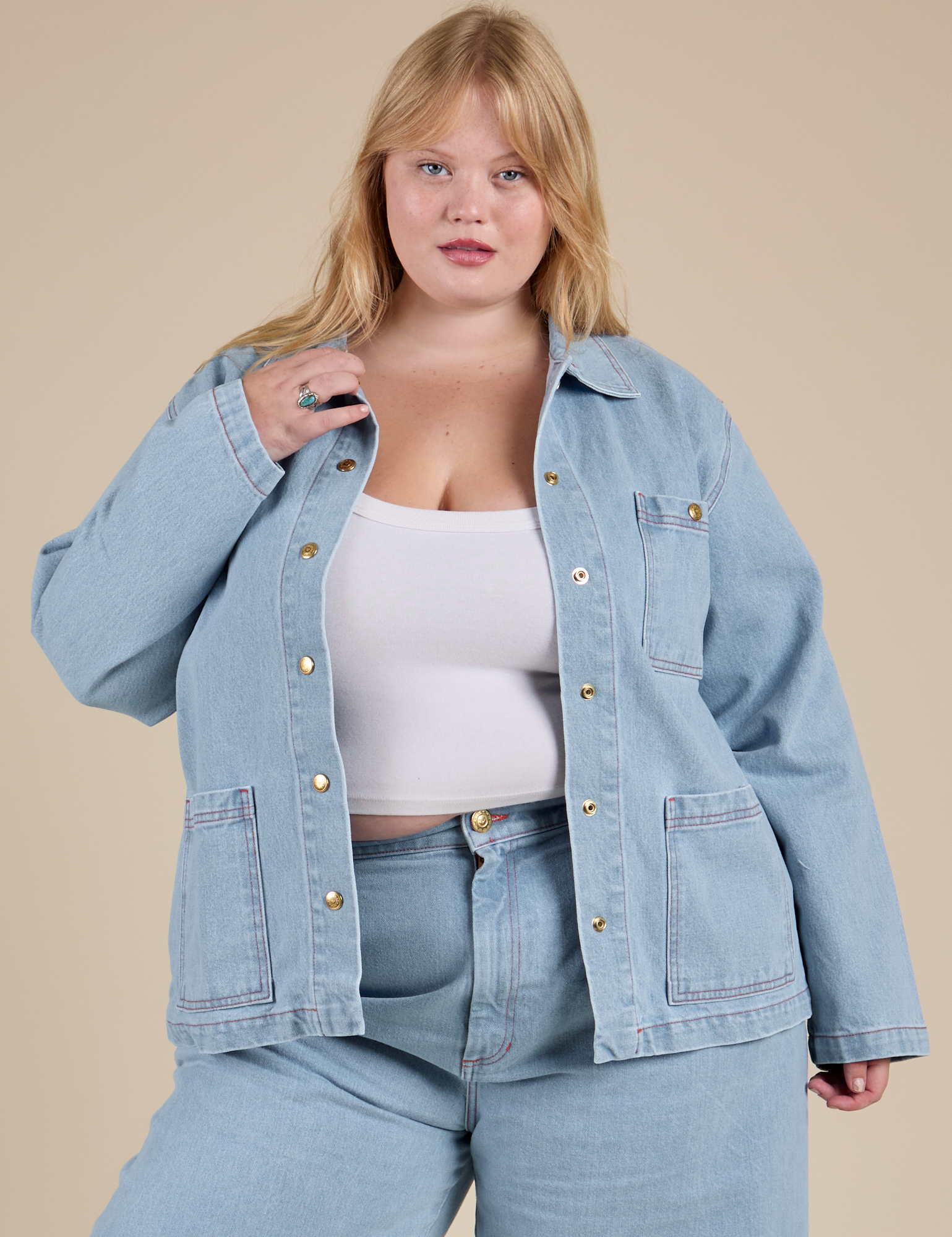 Juliet is 5'8" and wearing L Indigo Denim Work Jacket in Light Wash