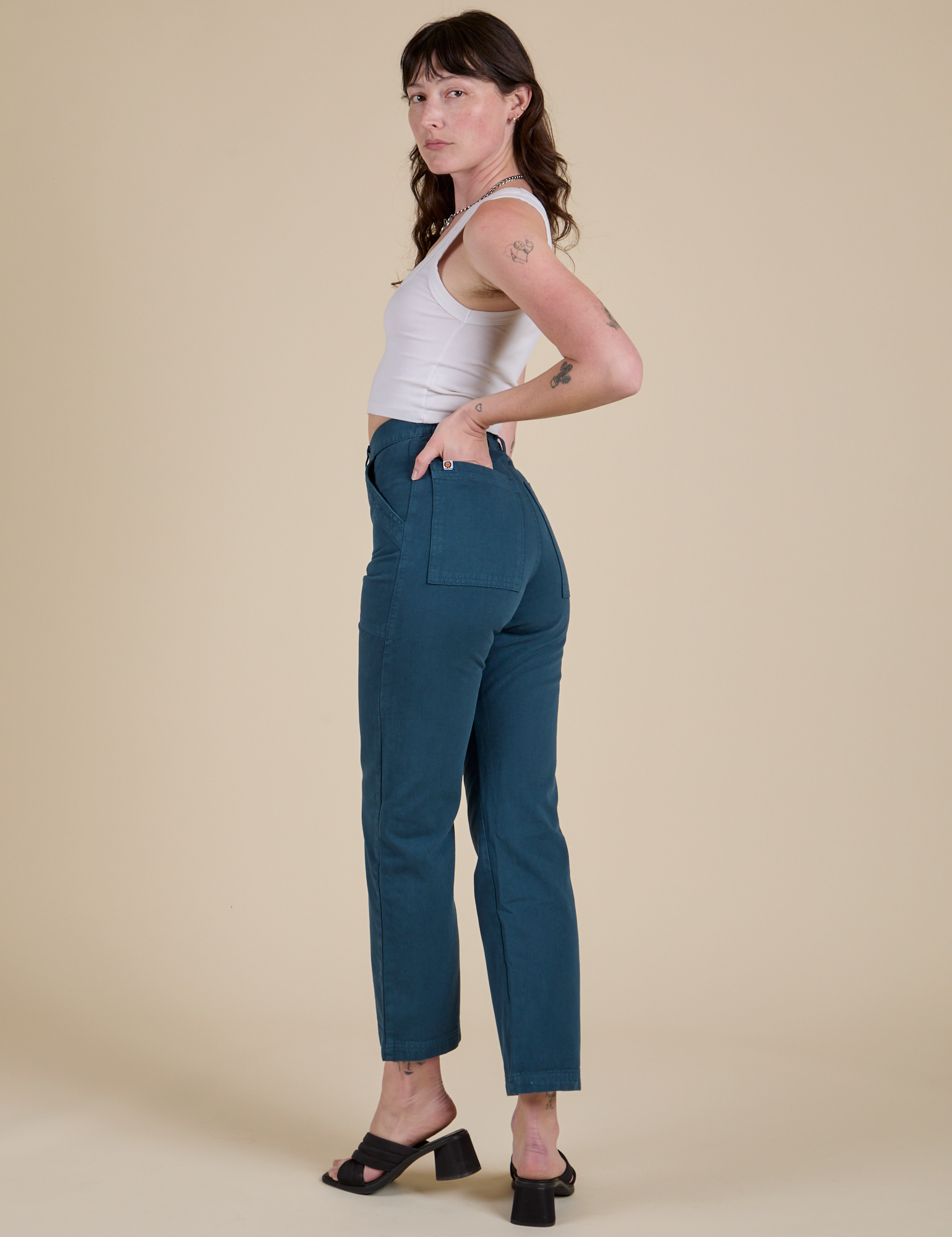 Work Pants in Lagoon angled back view on Alex