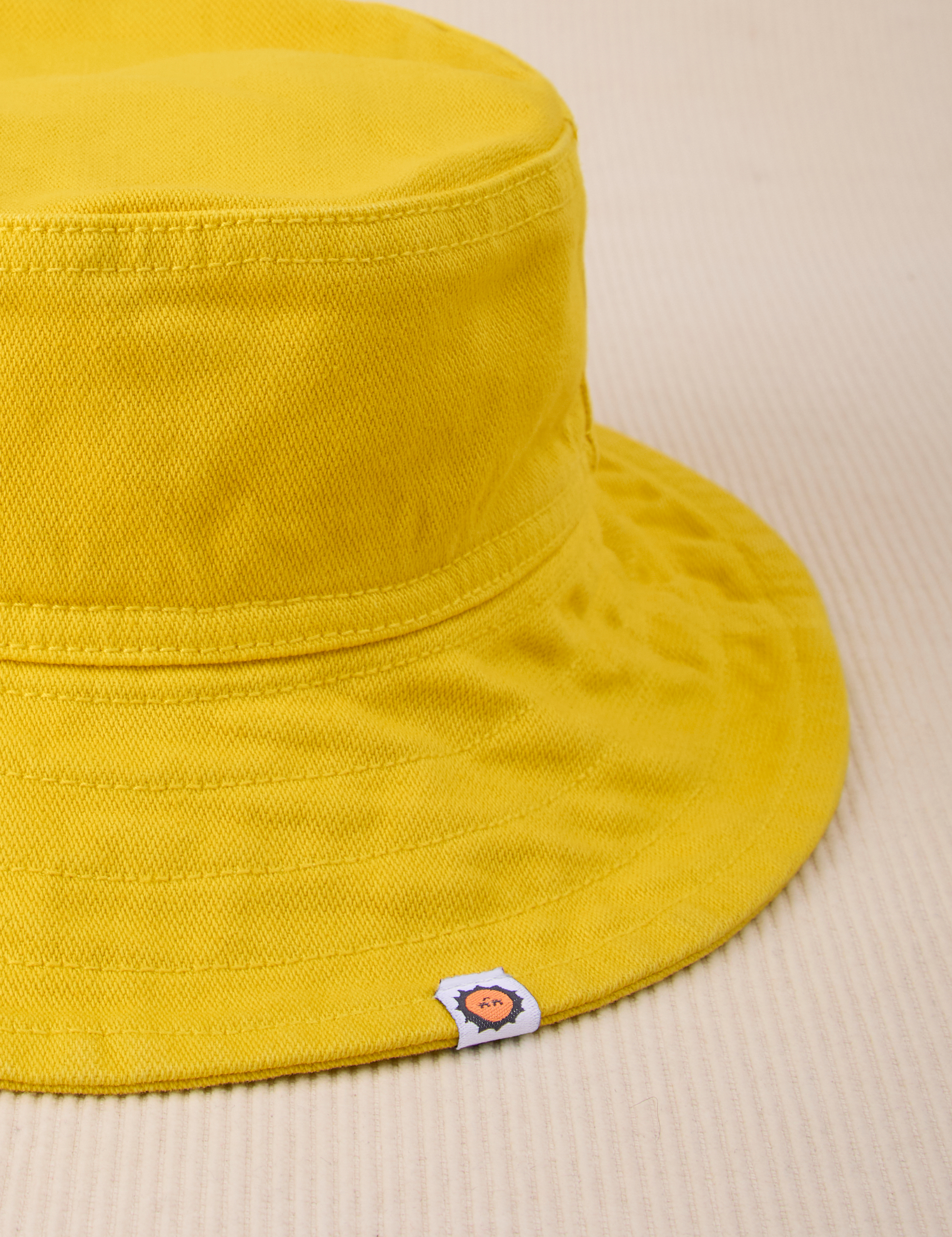 Wide Brim Denim Bucket Hats in Golden Yellow close up
