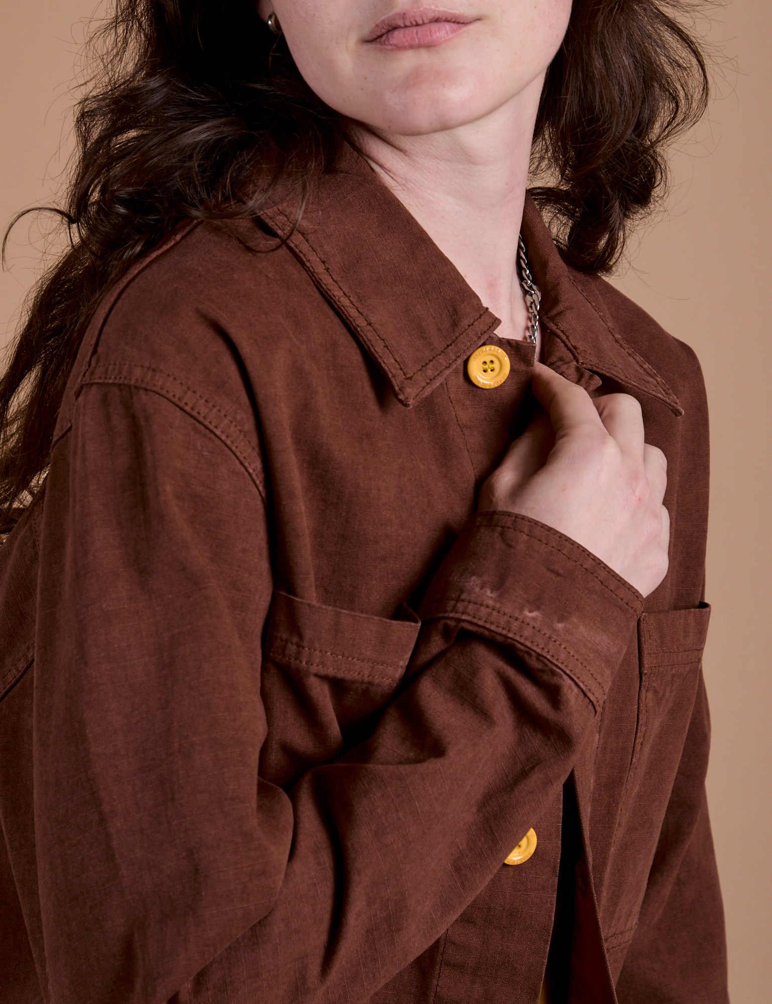 Close up of Ripstop Field Coat in Fudgesicle Brown on Alex