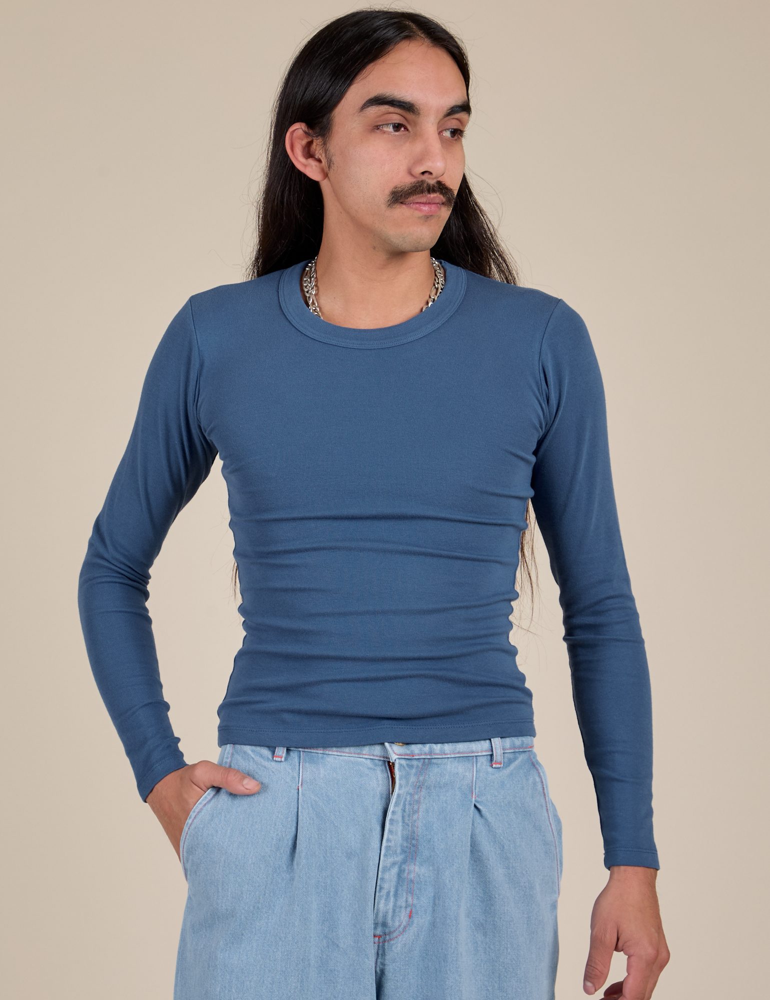 Anthony is 5'6" and wearing P Long Sleeve Baby Tee in French Blue