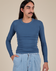 Anthony is 5'6" and wearing P Long Sleeve Baby Tee in French Blue