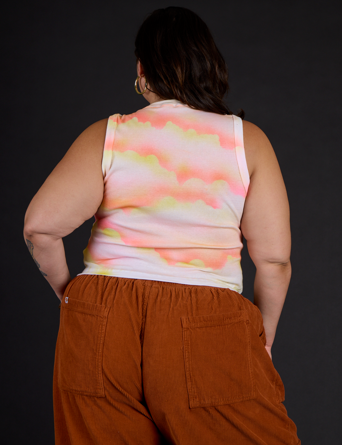 Back view of Kristen wearing the Black Star Airbrush Muscle Tee