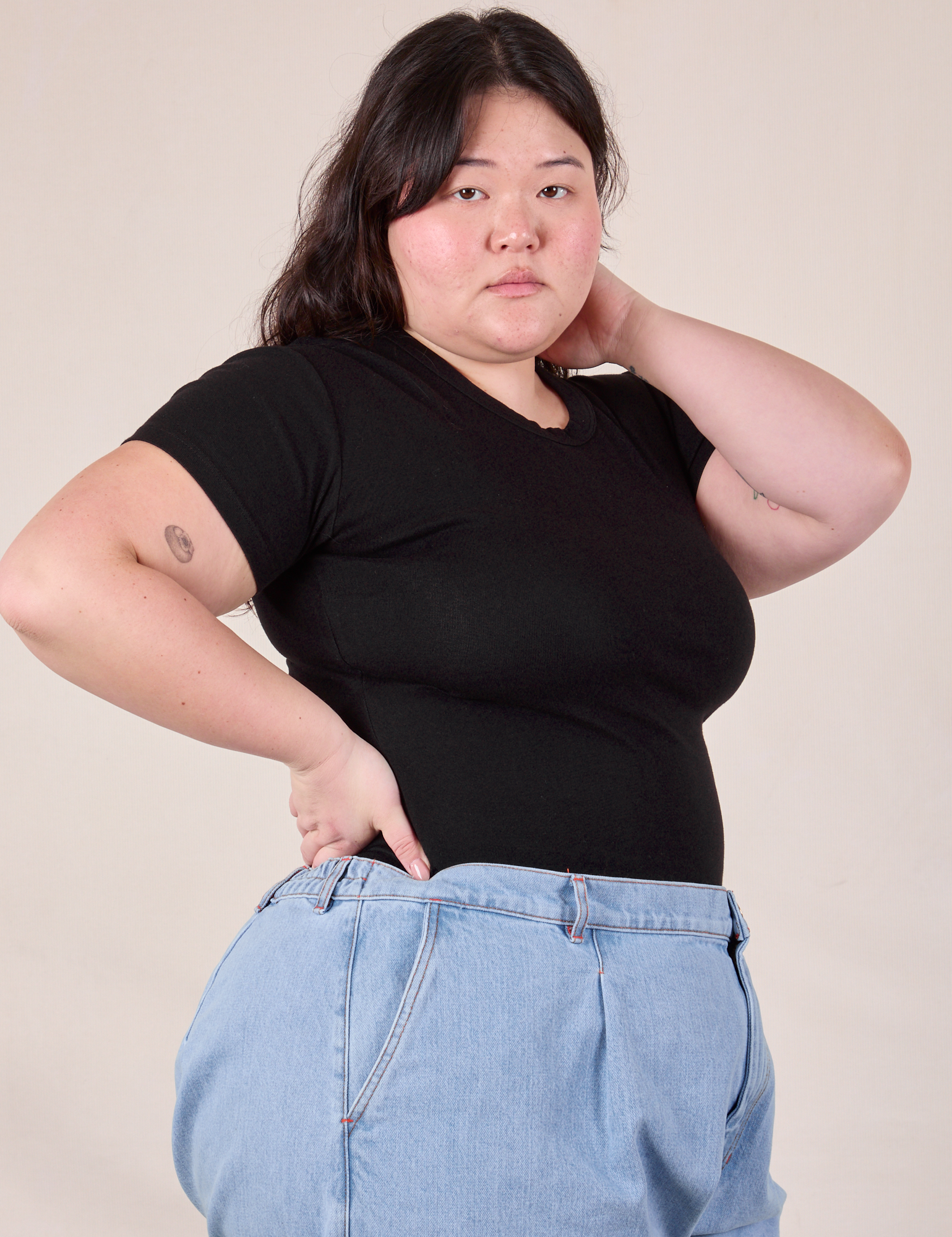 Baby Tee in Vintage Basic Black angled front view on Ashley