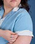 Close up of Painted Pantry Button-Up in Baby Blue sleeve