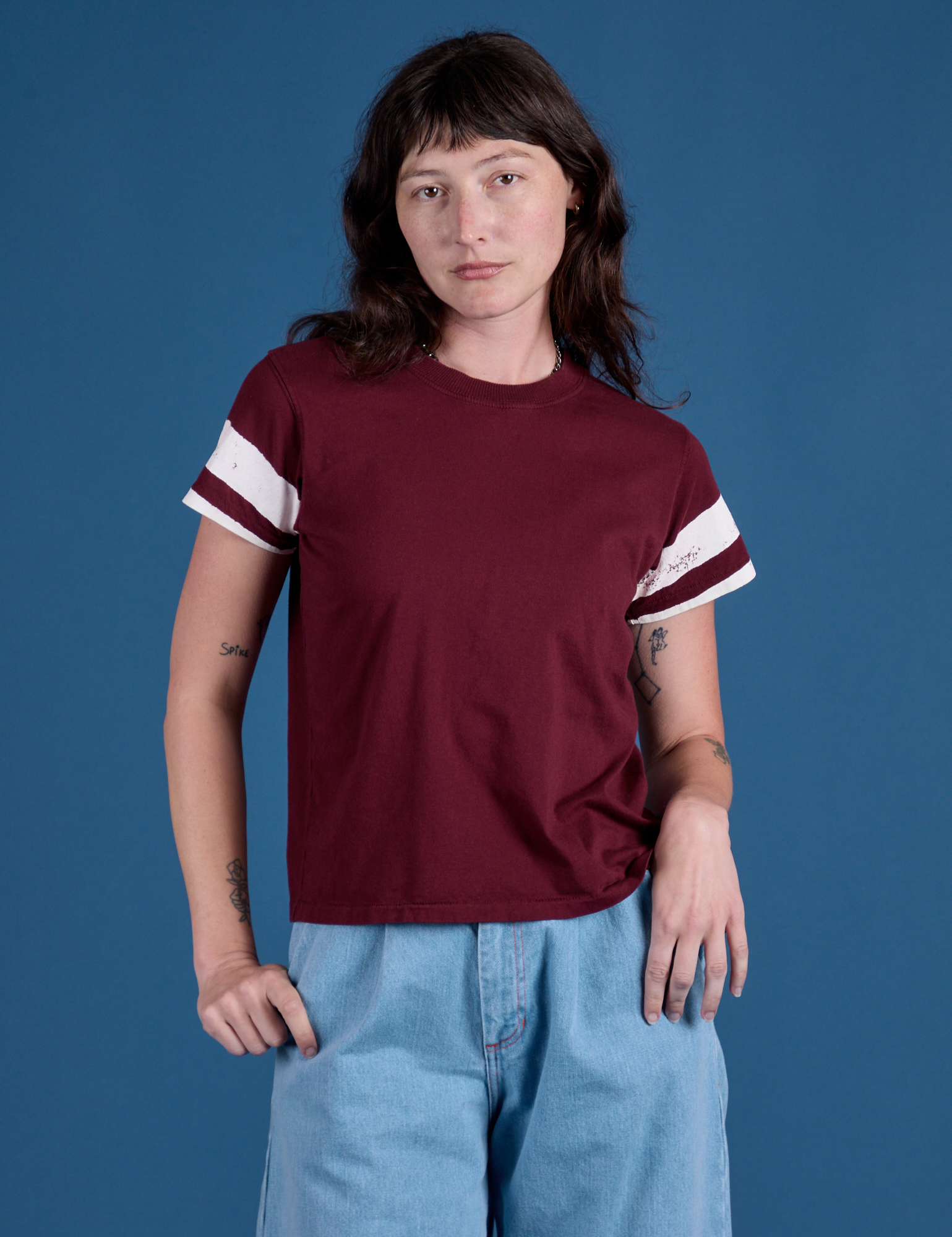 Alex is wearing Painted Vintage Tee in Red Wine