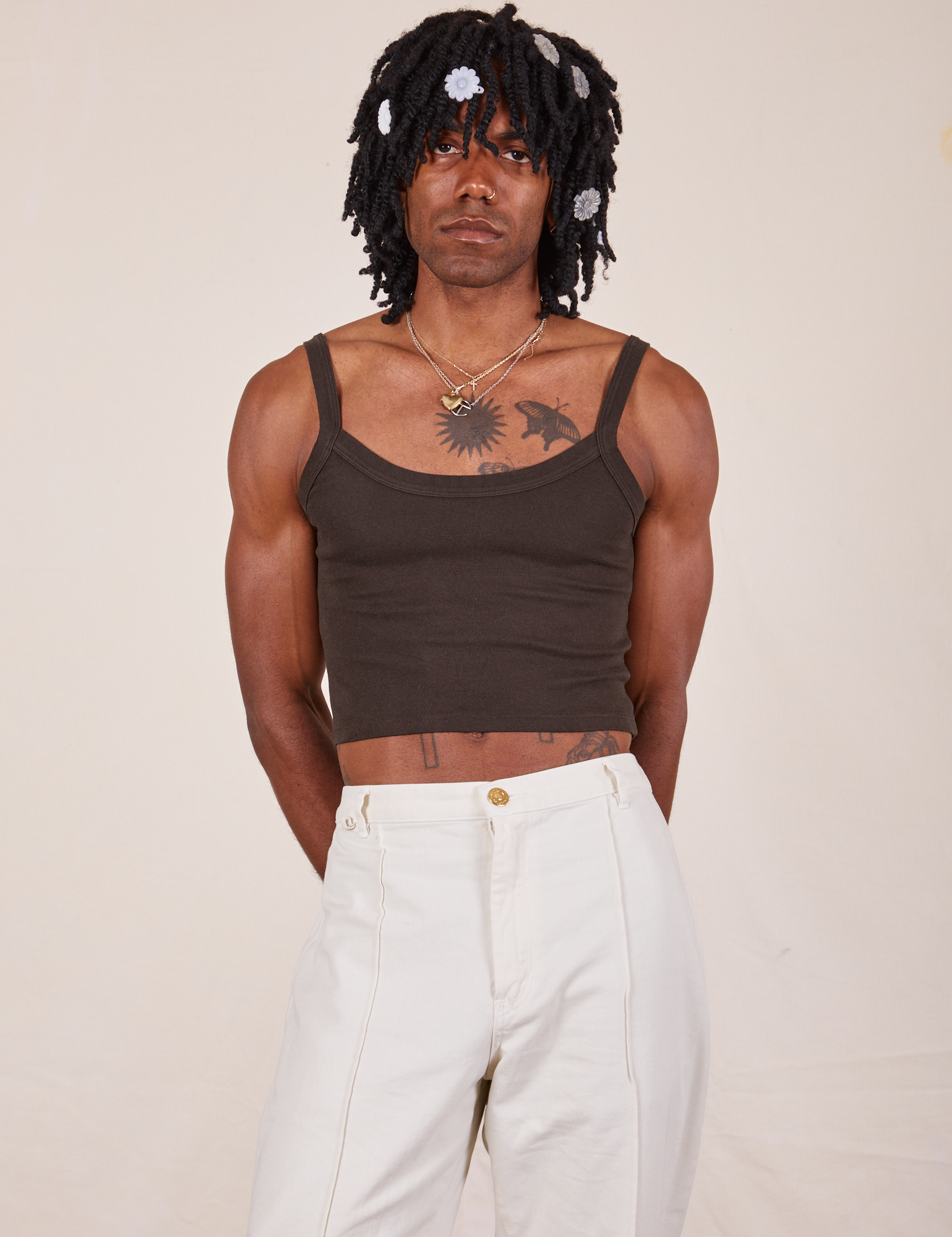 Jerrod is 6'3" and wearing S Cropped Cami in Espresso Brown paired with vintage tee off-white Western Pants