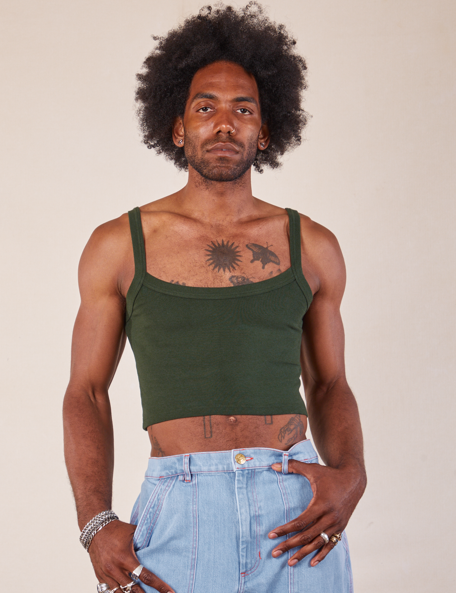 Jerrod is wearing Cropped Cami in Swamp Green
