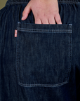 Close up of Juliet's hand in the back pocket of Denim Drop Pocket Pants in Dark Wash