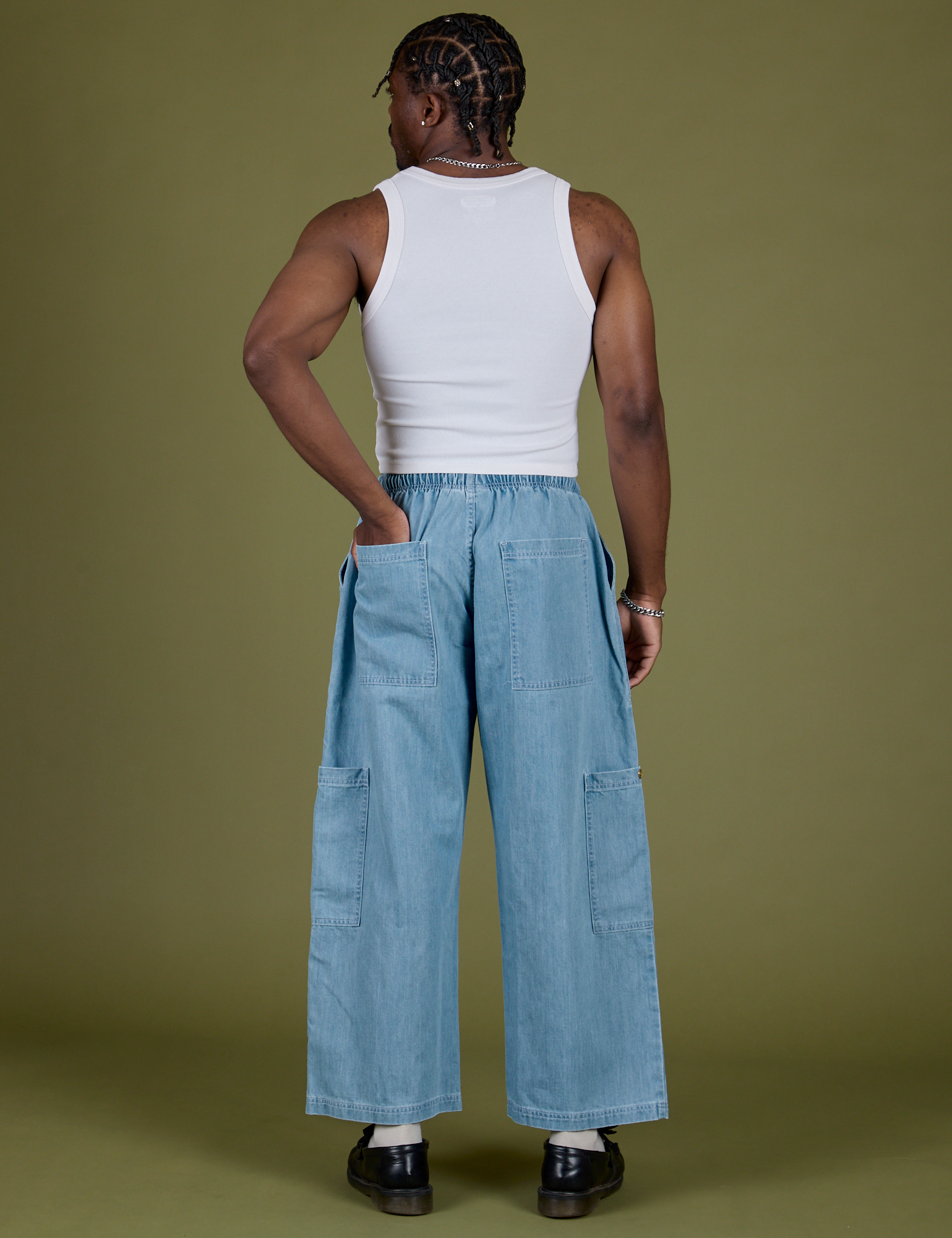 Back view of Denim Drop Pocket Pants in Light Wash and Cropped Tank in Vintage Tee White on Isaac