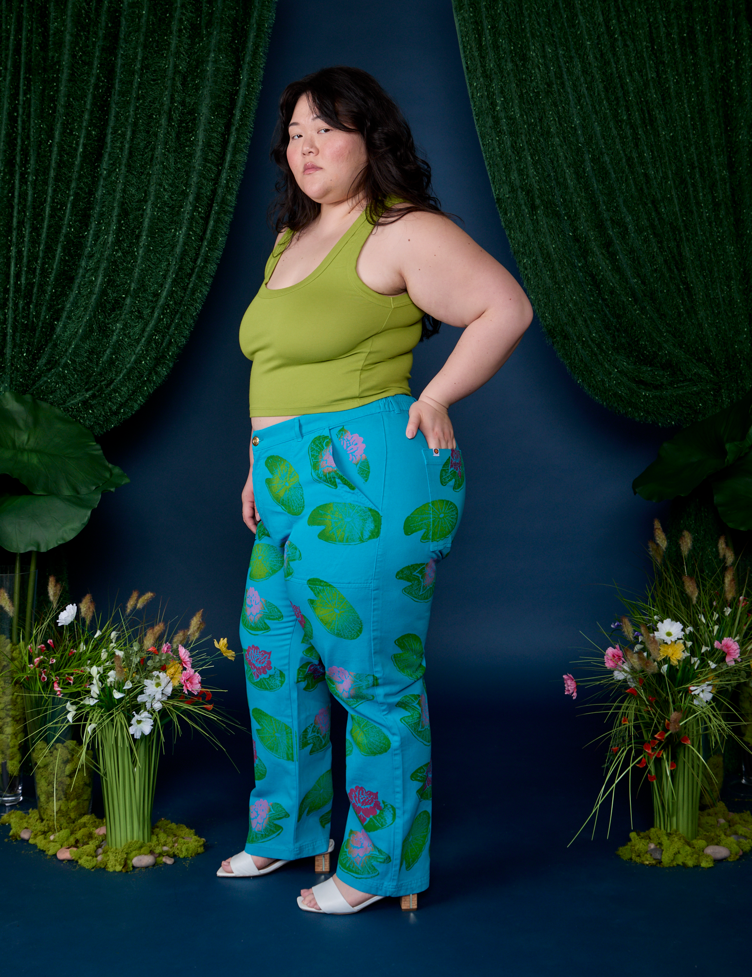 Side view of  Paintstamped Work Pants in Lilypad and gross green Cropped Tank on Ashley