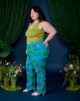 Side view of  Paintstamped Work Pants in Lilypad and gross green Cropped Tank on Ashley