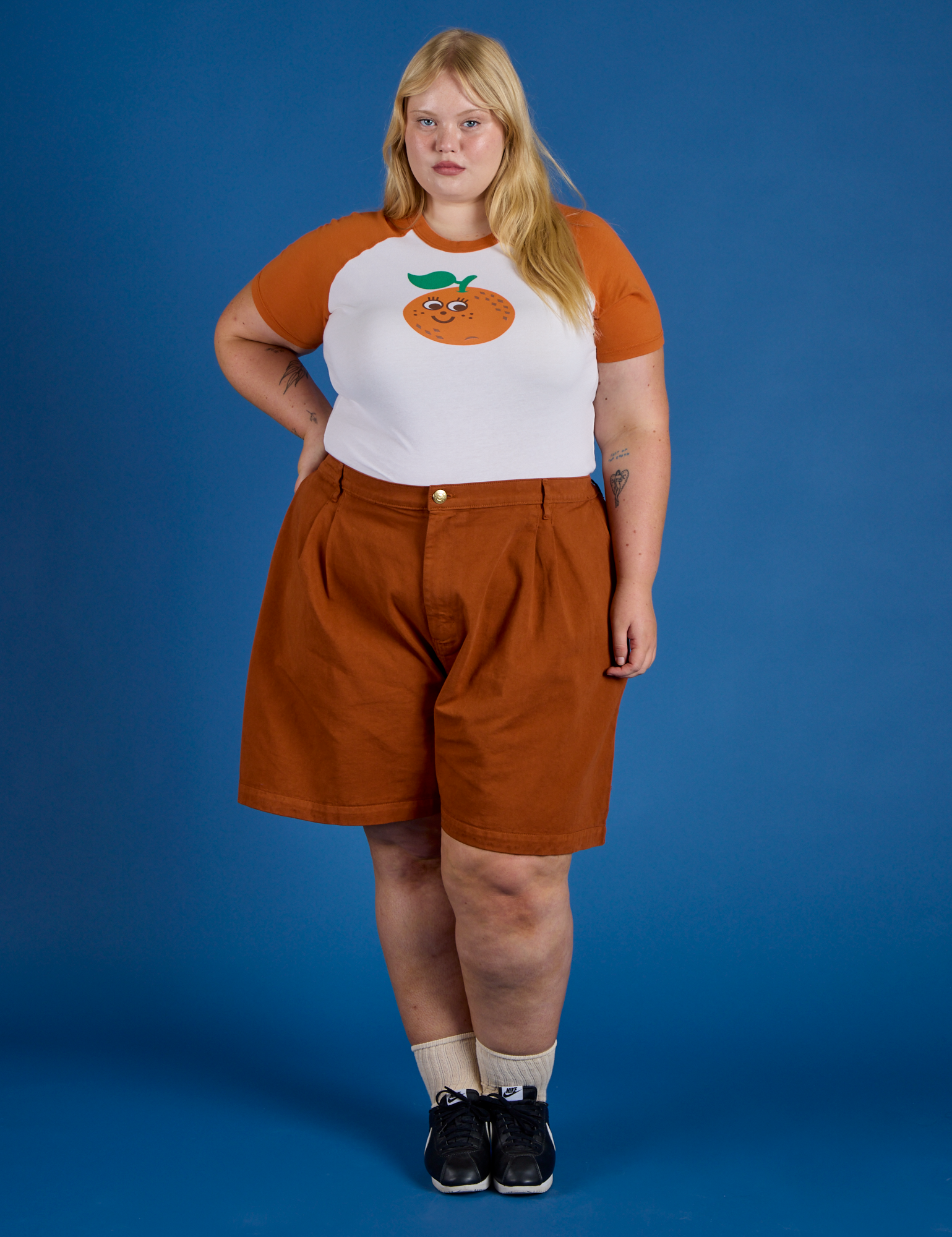 Juliet is wearing Produce Raglan Tee in Orange