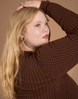Close up of Long Sleeve Baby Tee in Fudgesicle Brown shoulder on Juliet