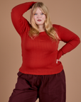 Juliet is 5’7” and wearing L Gingham Long Sleeve Baby Tee in Mustang Red
