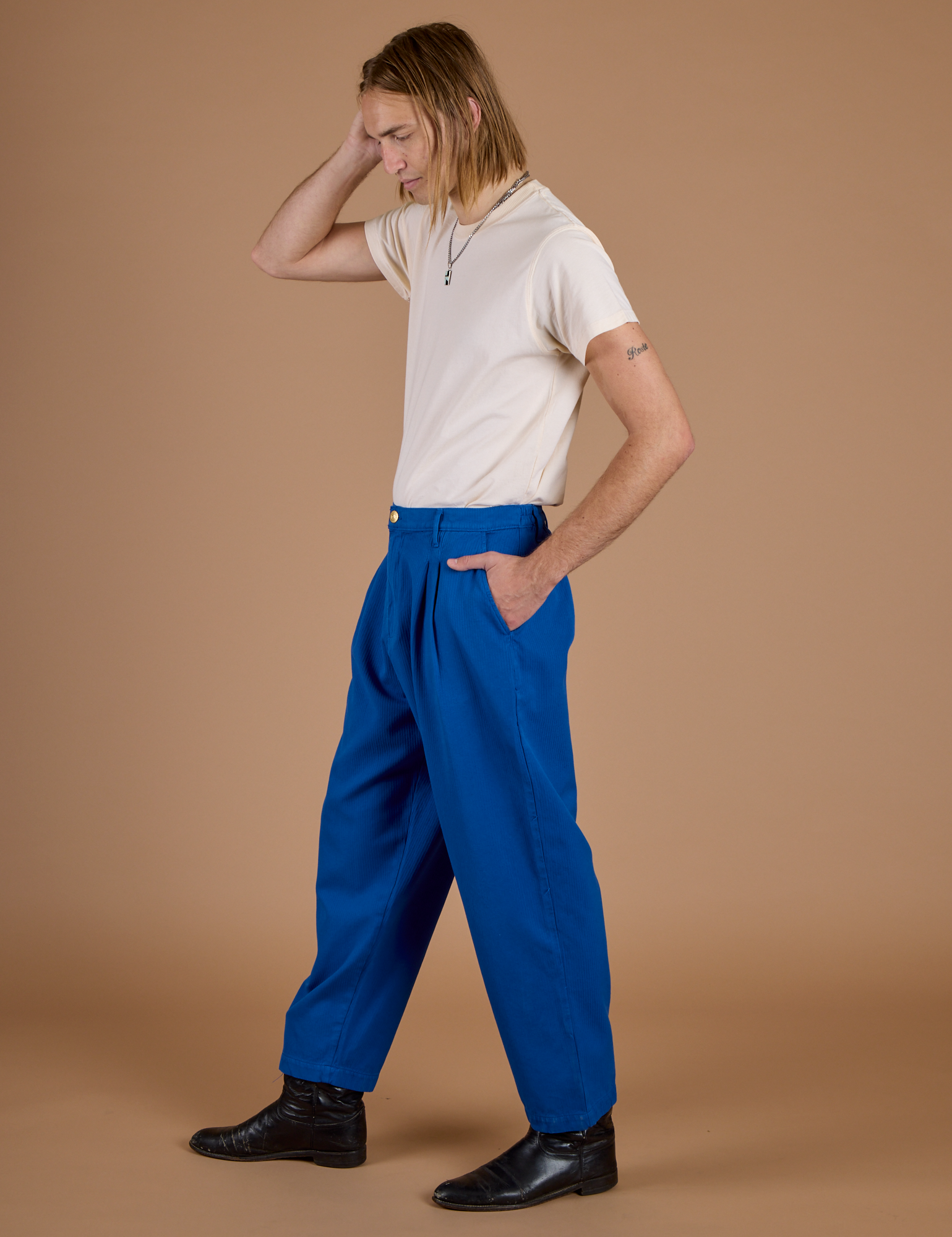 Side view of Heritage Trousers in Royal Blue and Organic Vintage Tee in Vintage Off-White
