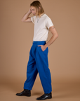 Side view of Heritage Trousers in Royal Blue and Organic Vintage Tee in Vintage Off-White