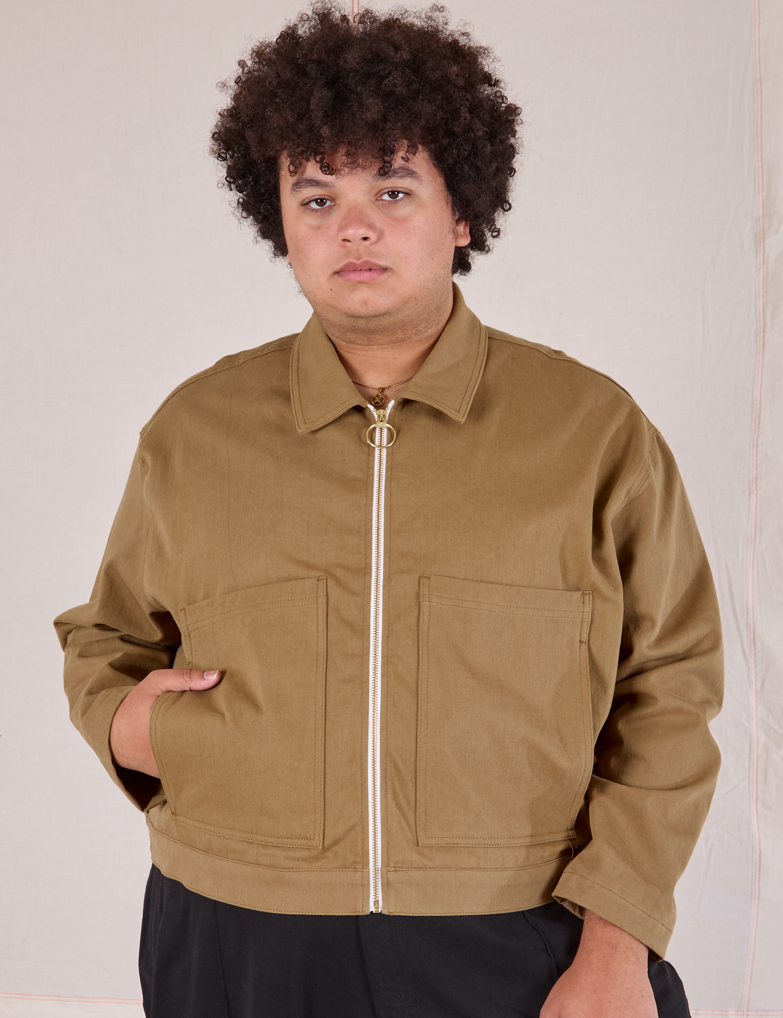 Miguel is 6’0” and wearing 1XL Mechanic Jacket in Desert Brown