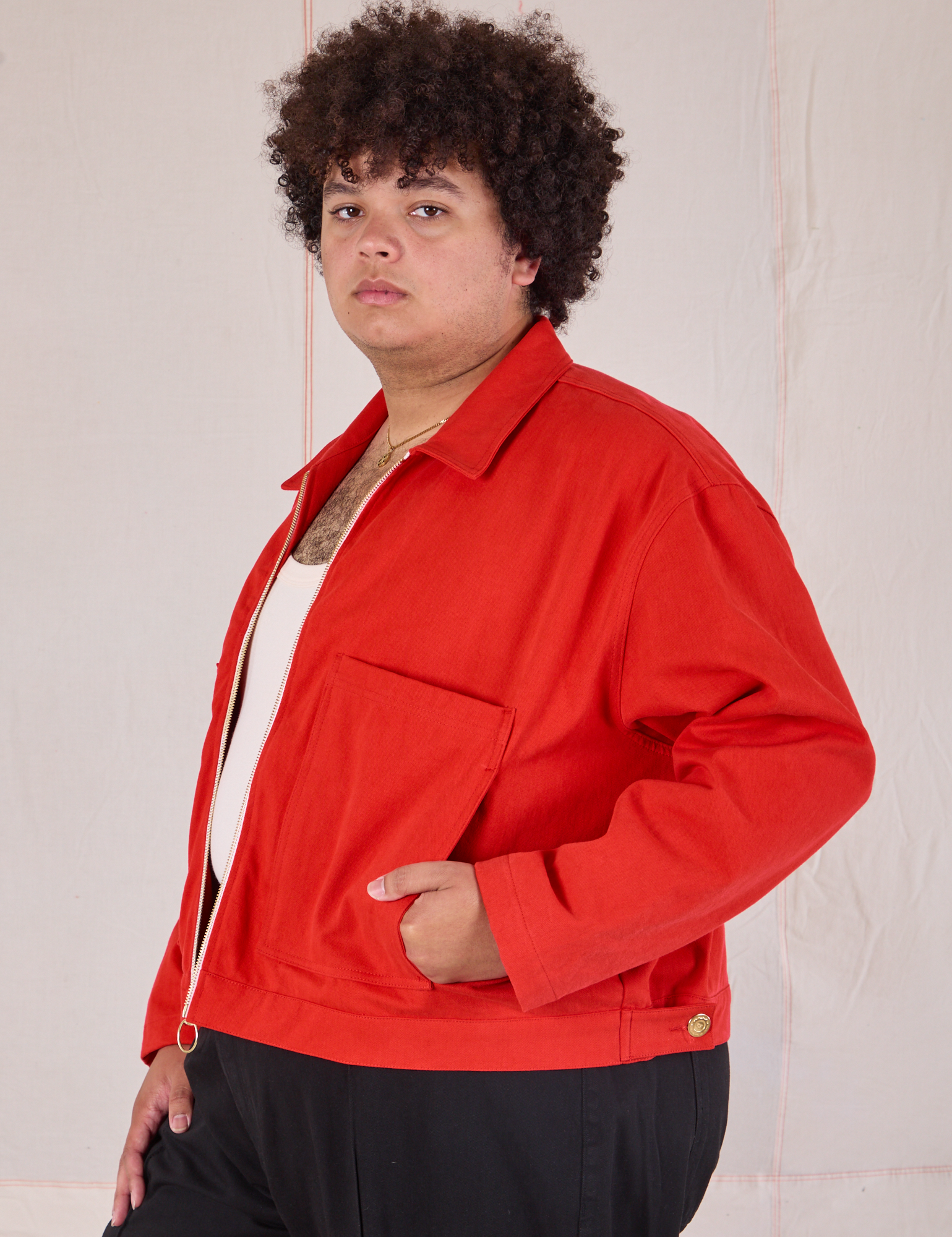 Mechanic Jacket in Mustang Red side view on Miguel