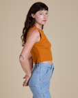 Muscle Tee in Creamsicle Orange side view on Alex