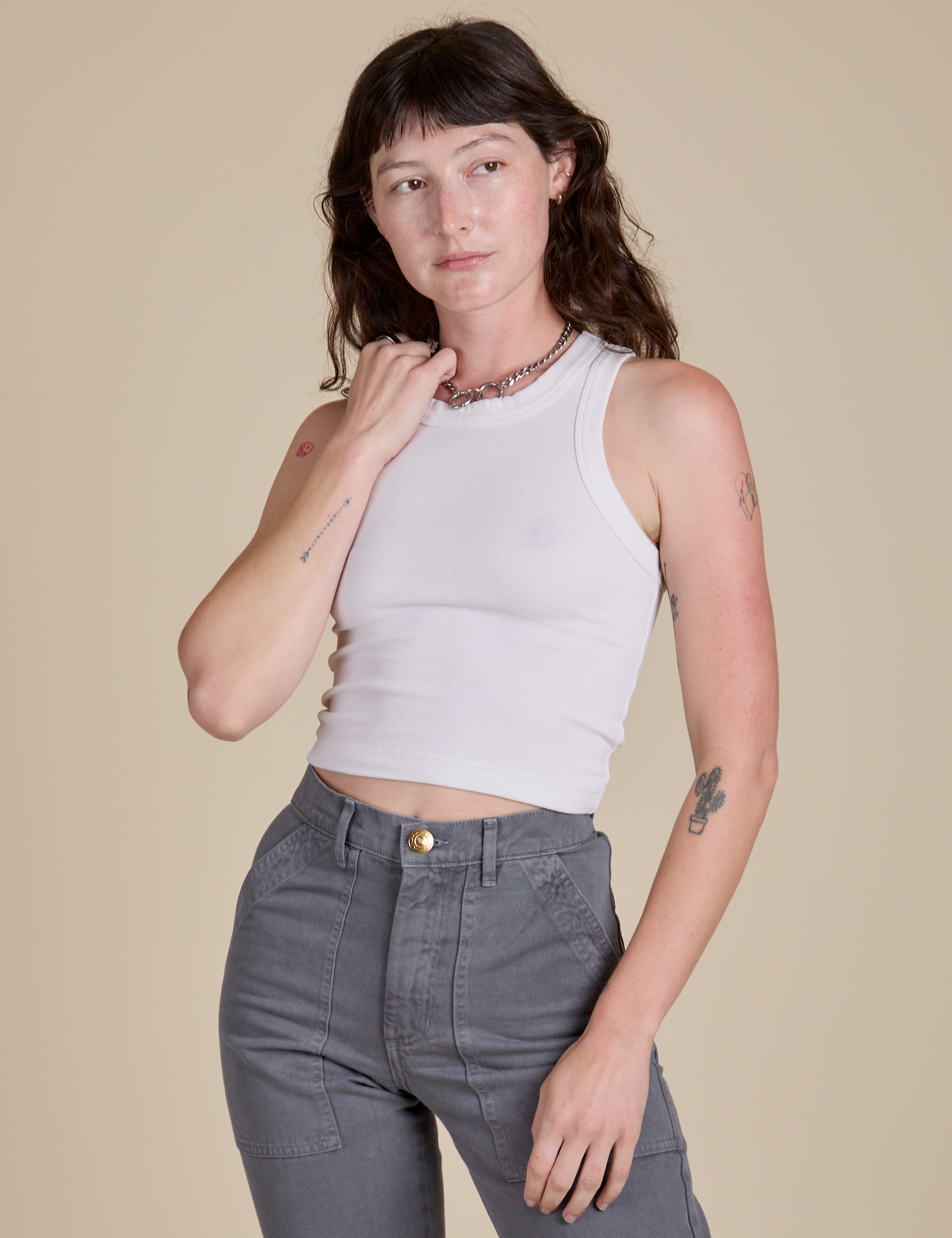 Alex is 5’8” and wearing P Racerback Tank in Vintage Tee White