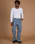 Isaac is 5’10” and wearing M Railroad Denim Work Pants in Natural paired with long sleeve baby tee in Vintage Tee White