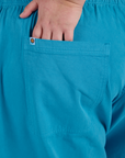 Close up of Juliet's hand in the back pocket of Drop Pocket Cargo Pants in Hawaiian Blue