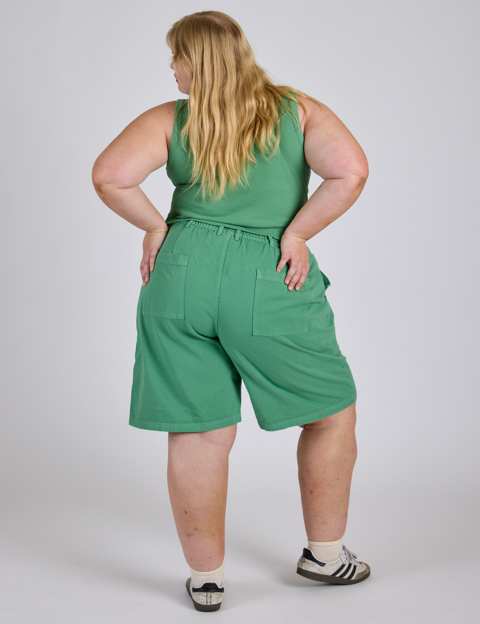 Longline Work Shorts in Seafoam Green back view on Juliet