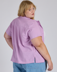 Angled back view of Pantry Button-Up in Lilac Purple on Juliet