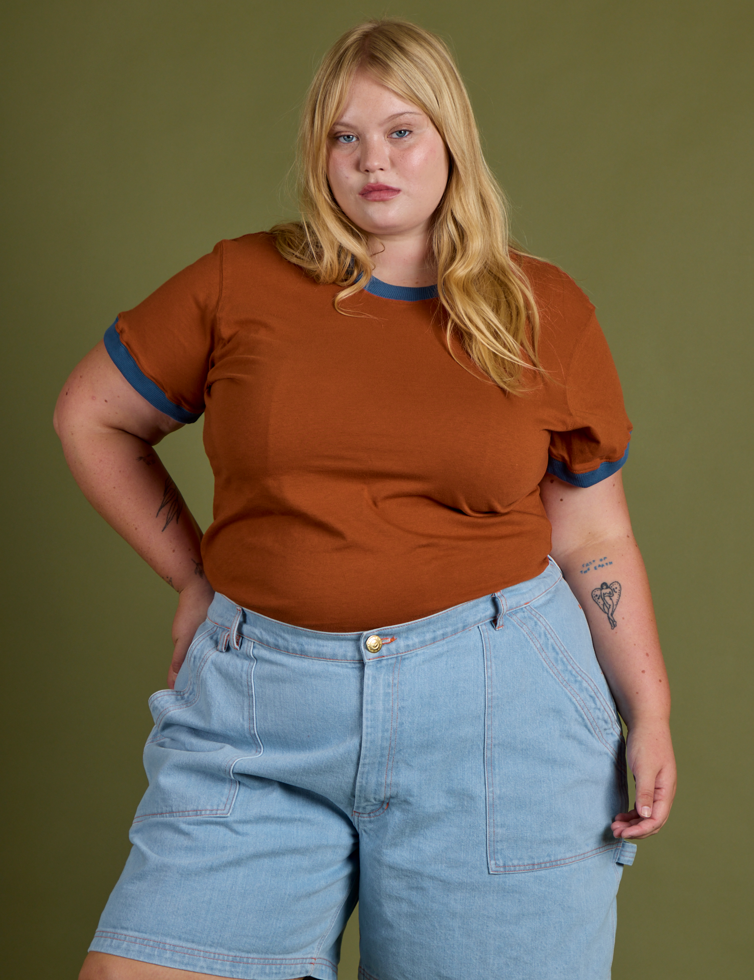 Juliet is wearing Vintage Ringer Tee in Burnt Terracotta and light wash Carpenter Shorts